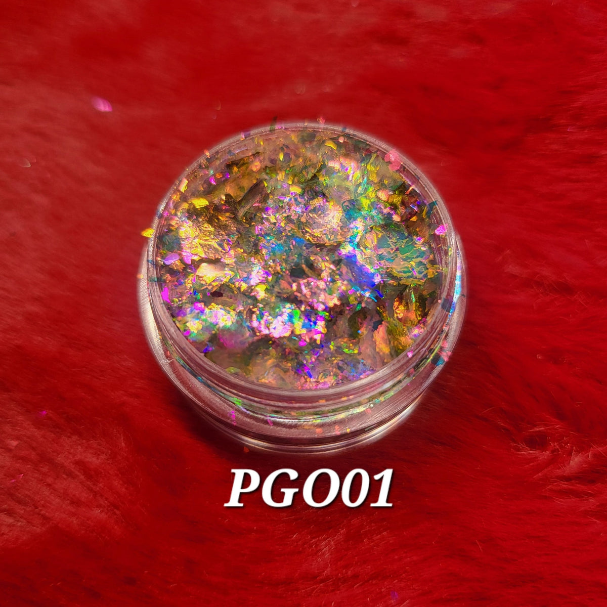 Close-up of Flakes Eye Shadow in shade PGO01, showcasing its shimmering powder texture and compact case design