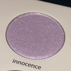 Eyeshadow, light purple shimmer, round compact, innocence text visible