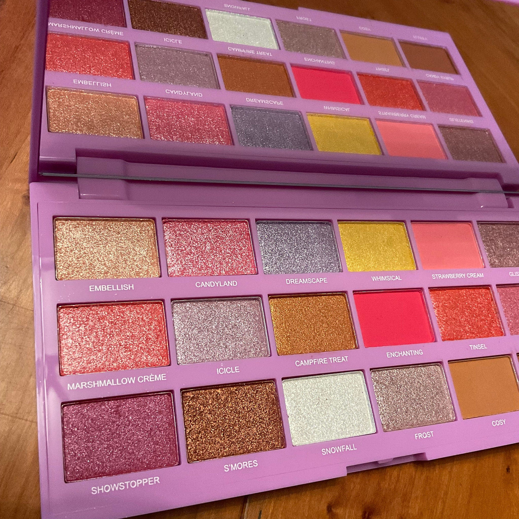 Side view of Marshmallow Wonderland palette showing pastel eyeshadow pans in heart-shaped compact with gold details