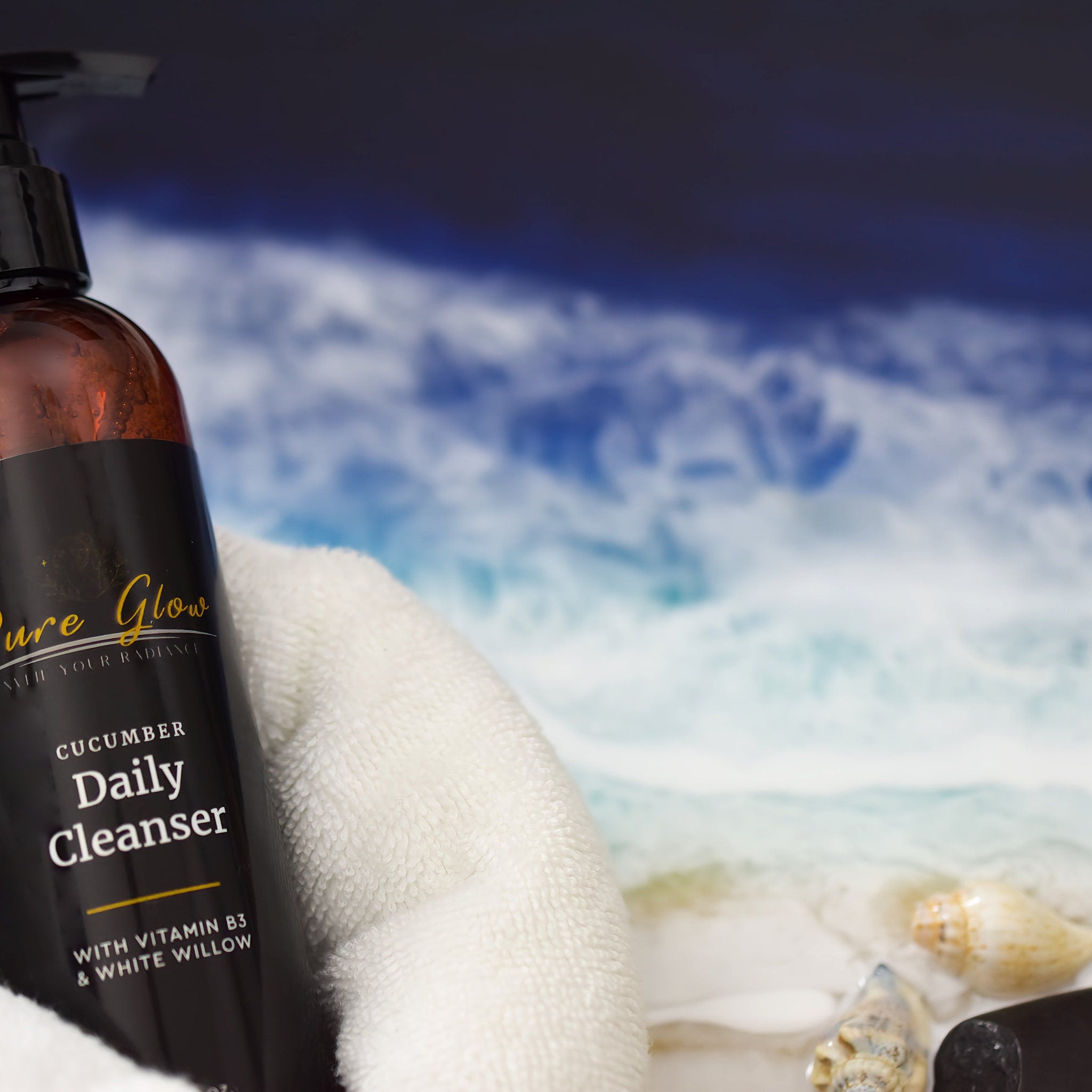 Cucumber Daily Cleanser bottle, brown glass, black pump, white towel, Pure Glow label visible