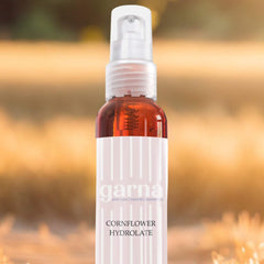 Toner spray bottle, clear plastic, brown liquid, white label with Garna text
