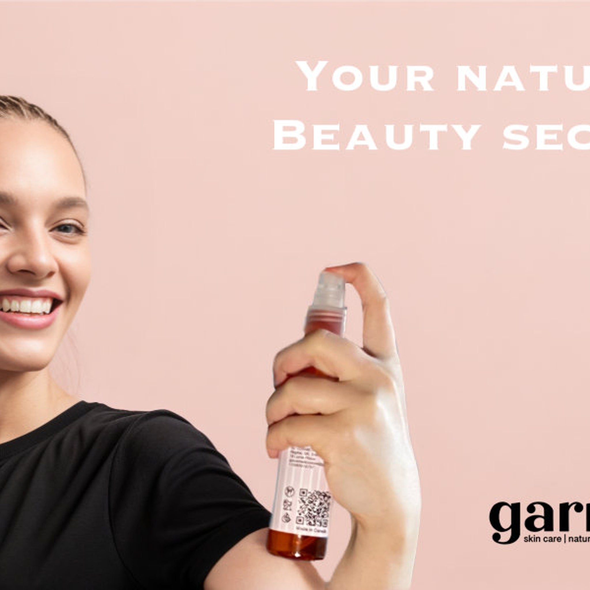 Woman spraying brown bottle, black shirt, pink background with "garri" logo visible