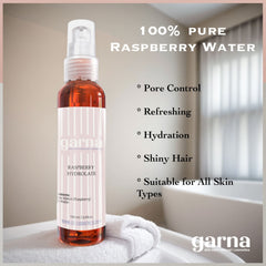 Raspberry Hydrolate bottle, clear with red liquid, white label with pink stripes, Garna brand