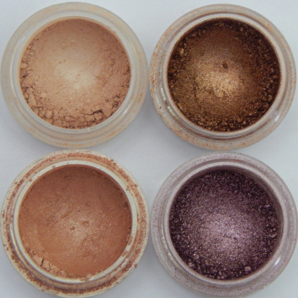 Close-up of Mineral Eyeshadow in Fancy Girl Collection showing vibrant pressed powder palette with shimmer finish