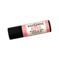 Lip balm with pink floral pattern, black tube, and Wild Rose Rosebud label