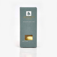 Box with &Premium branding, textured teal material, and a visible yellow item inside