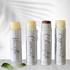 Lip balms, white tubes with flavors, vanilla, coconut, chocolate, peppermint, Veda Essential Canada