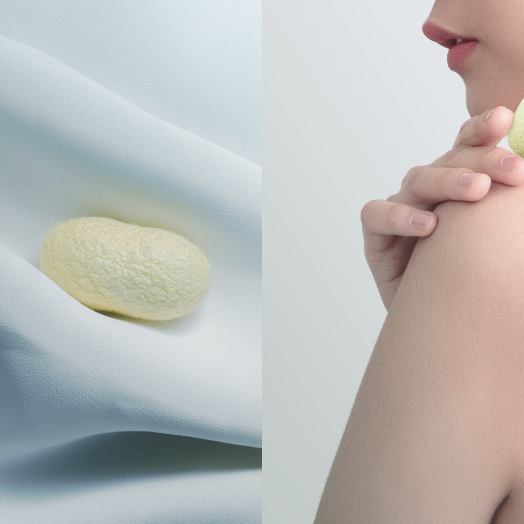 Silk cocoon on light blue fabric, woman's arm with yellow item, close up shot