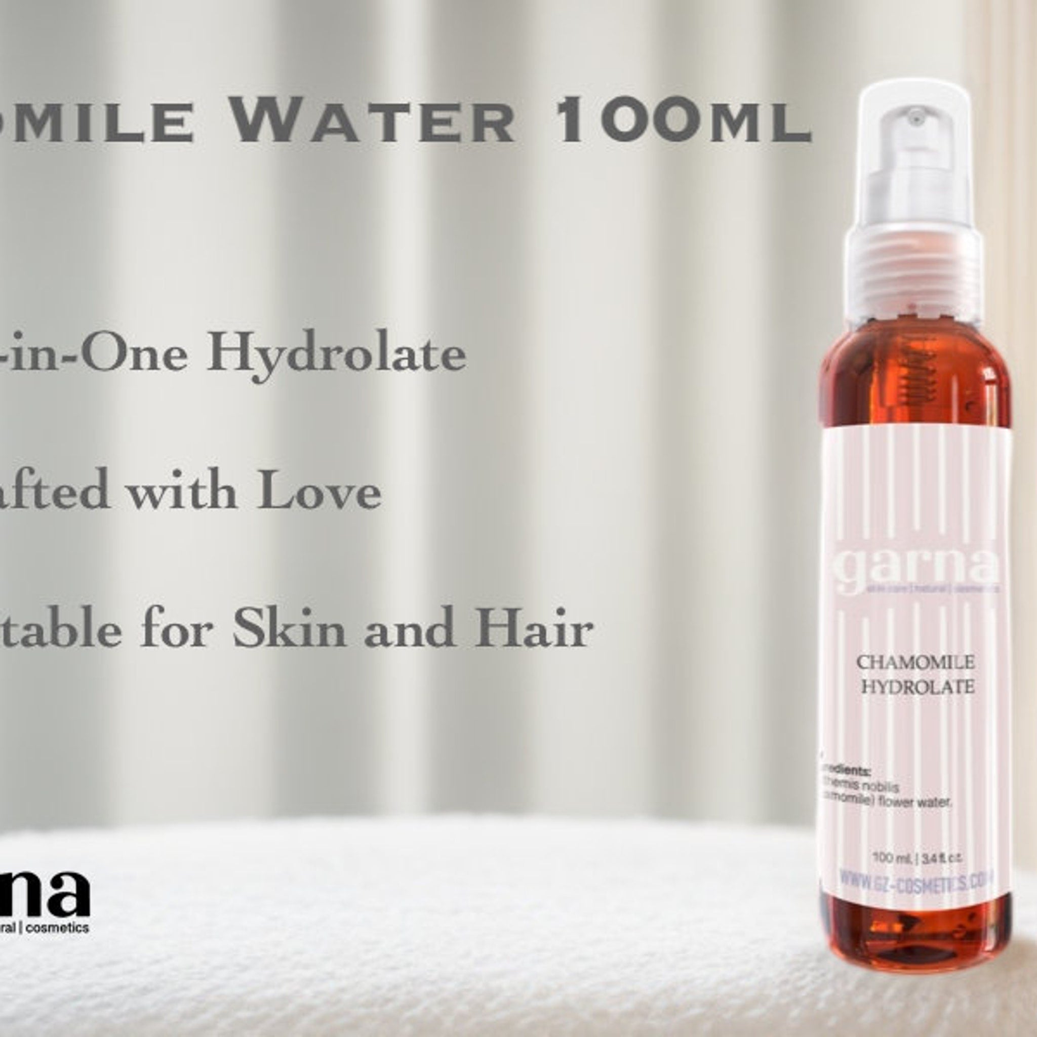 Chamomile Hydrolate bottle with clear, amber liquid, white and pink label, garna branding