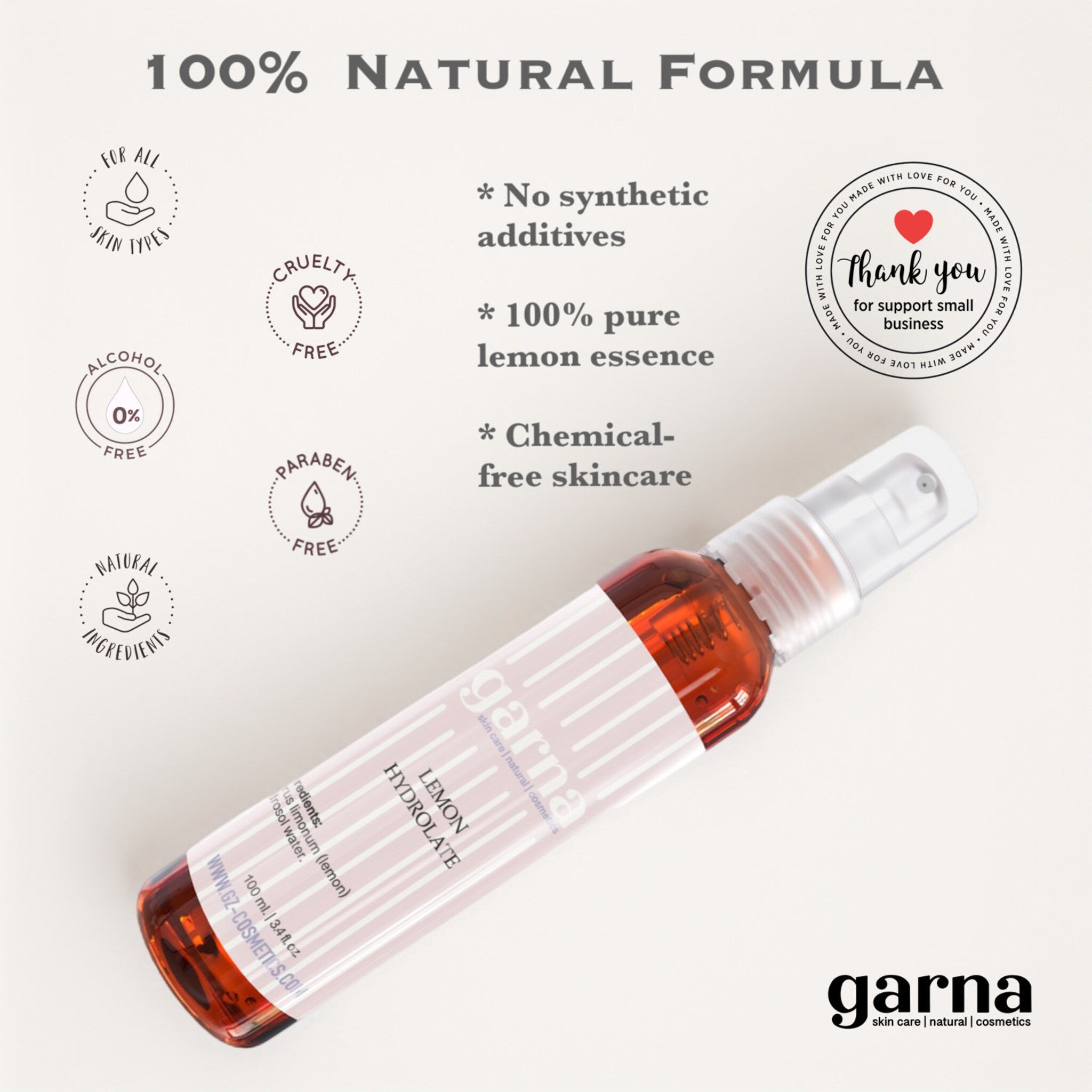 Lemon Hydrolate bottle, amber liquid, white and pink label, garna brand