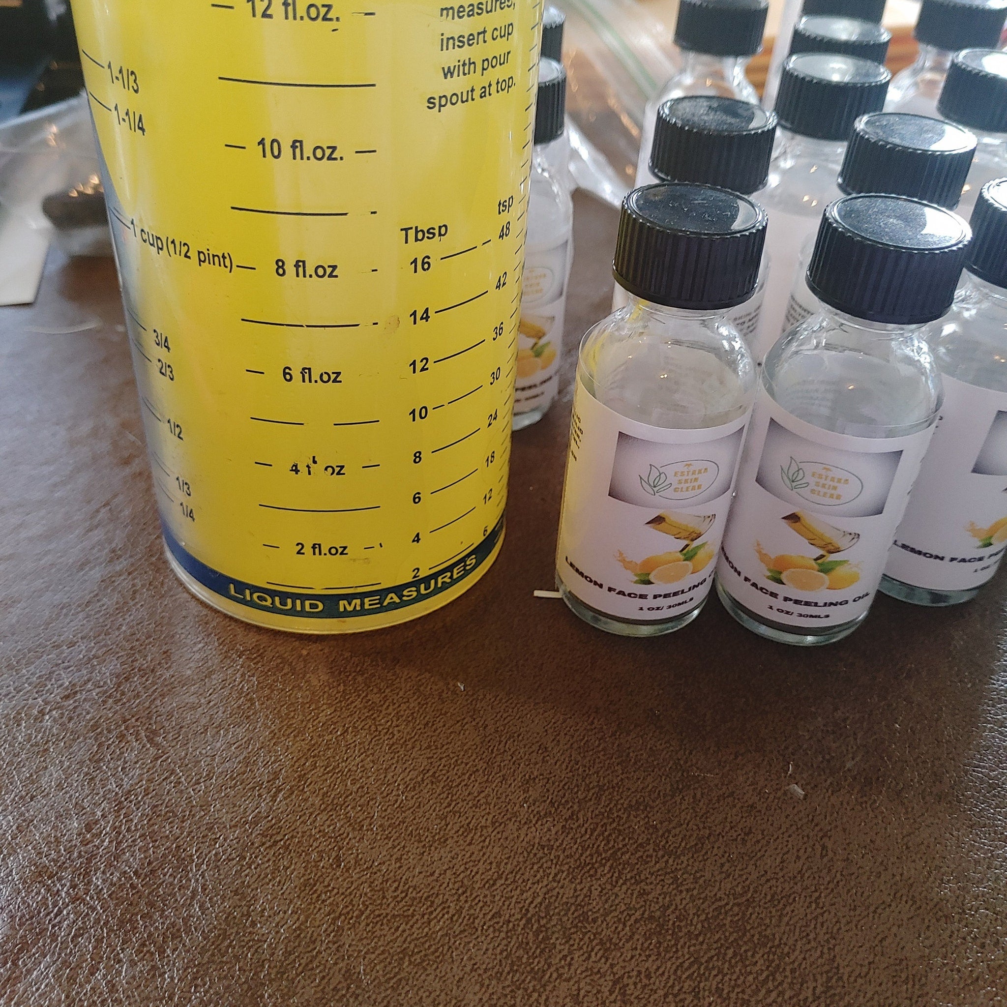 Golden yellow peeling oil in sleek amber glass bottle with precision dropper applicator