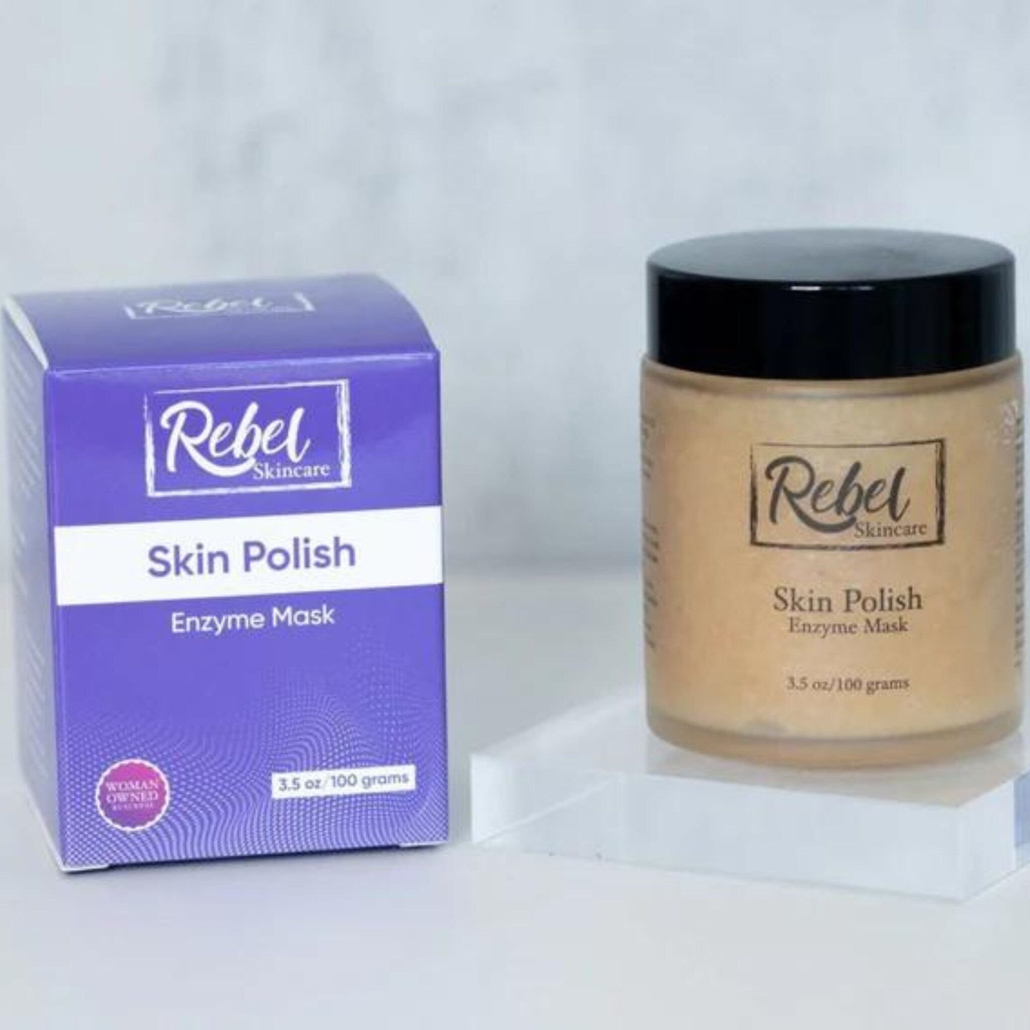 Skin Polish enzyme mask in purple box and tan jar with black lid, Rebel Skincare branding visible