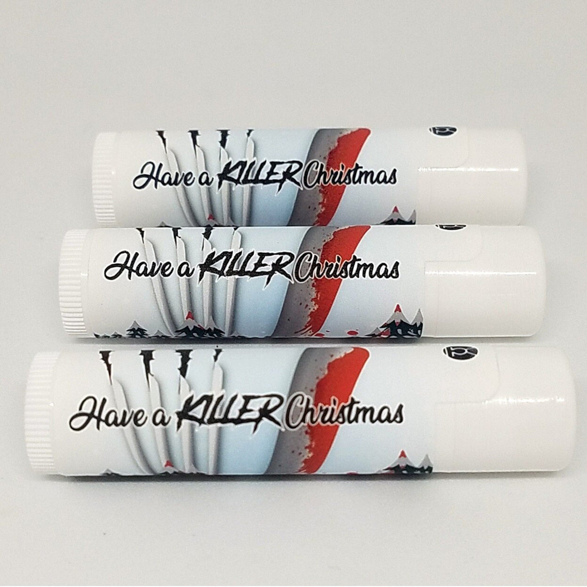 Lip balms with white tubes, "Have a KILLER Christmas" text, and a graphic design