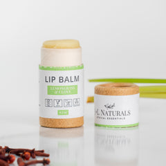Lip balm with white and brown tube, visible "jnlnaturals" label, and exposed balm