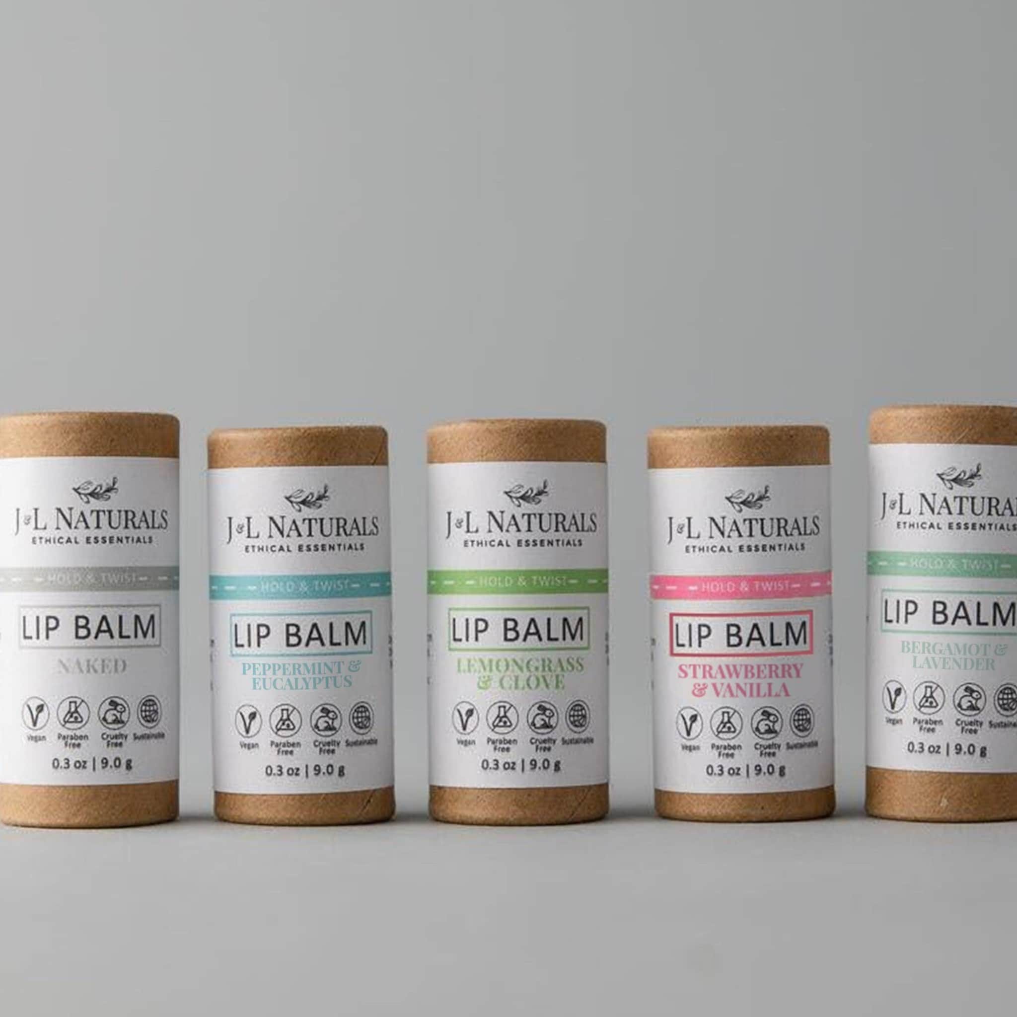 Lip balm set with cardboard tubes, various color labels, and J&L Naturals branding