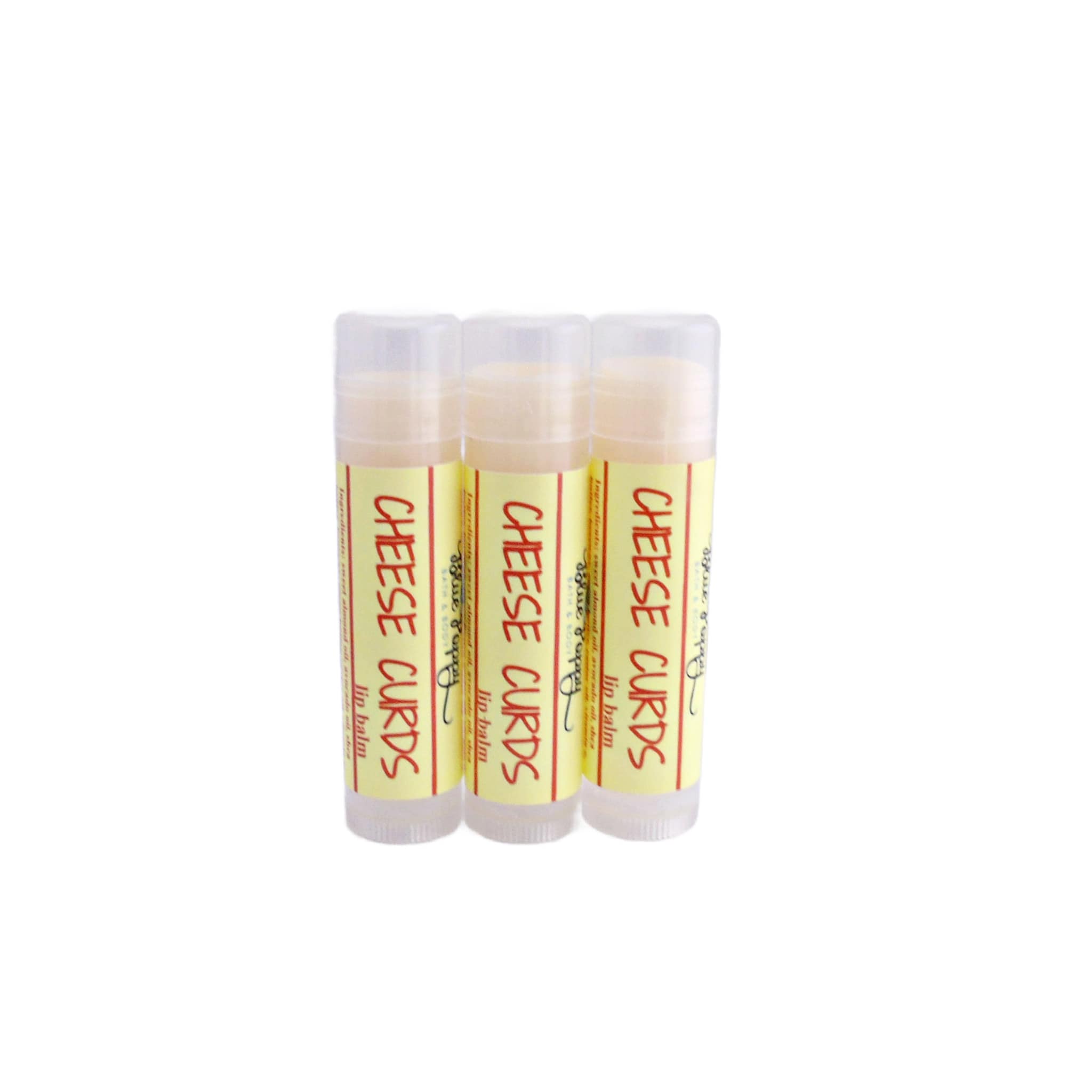 Lip balm tubes with yellow label and "Cheese Curds" text, clear cap and white background