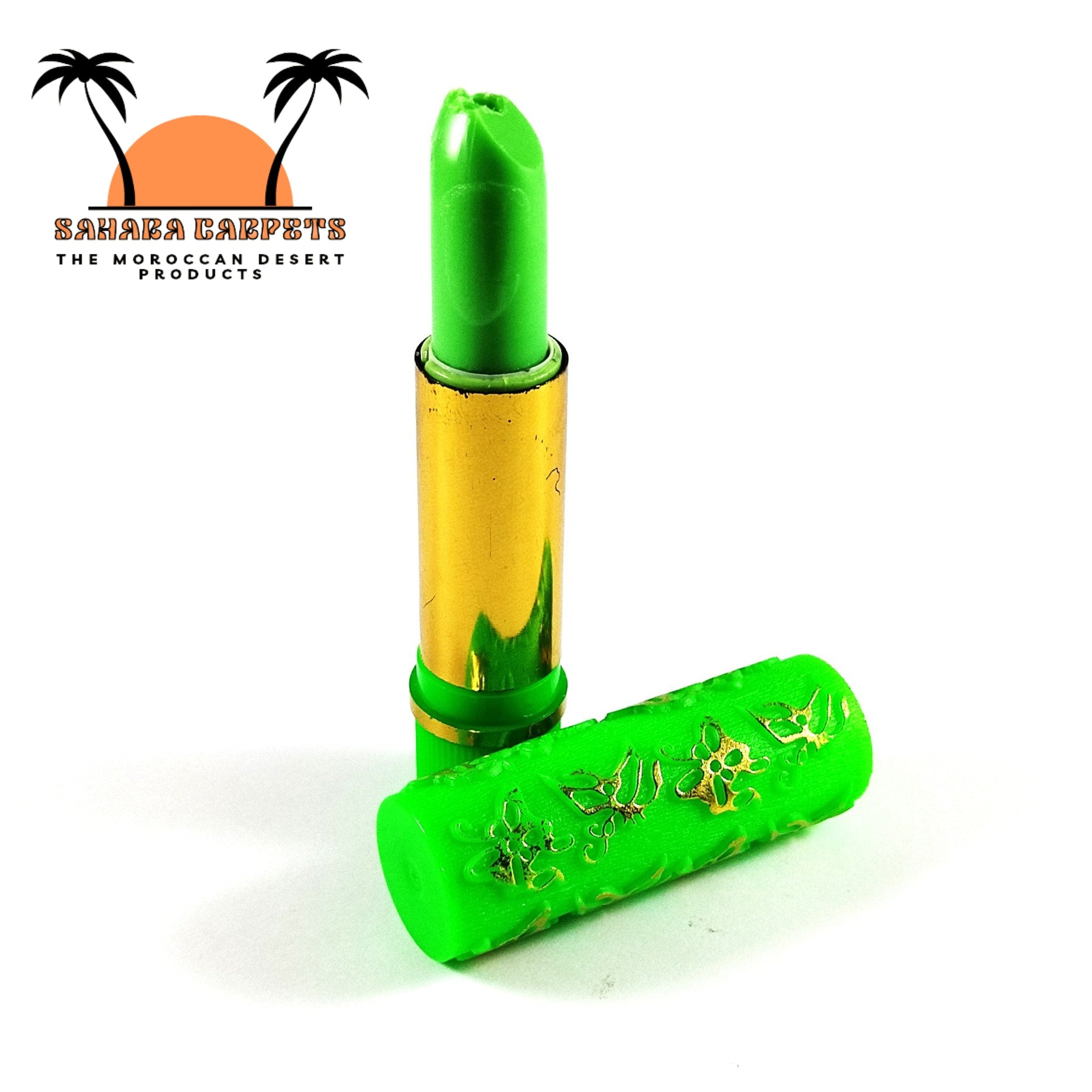Lipstick green with gold metallic tube and patterned cap, Moroccan Magic brand visible