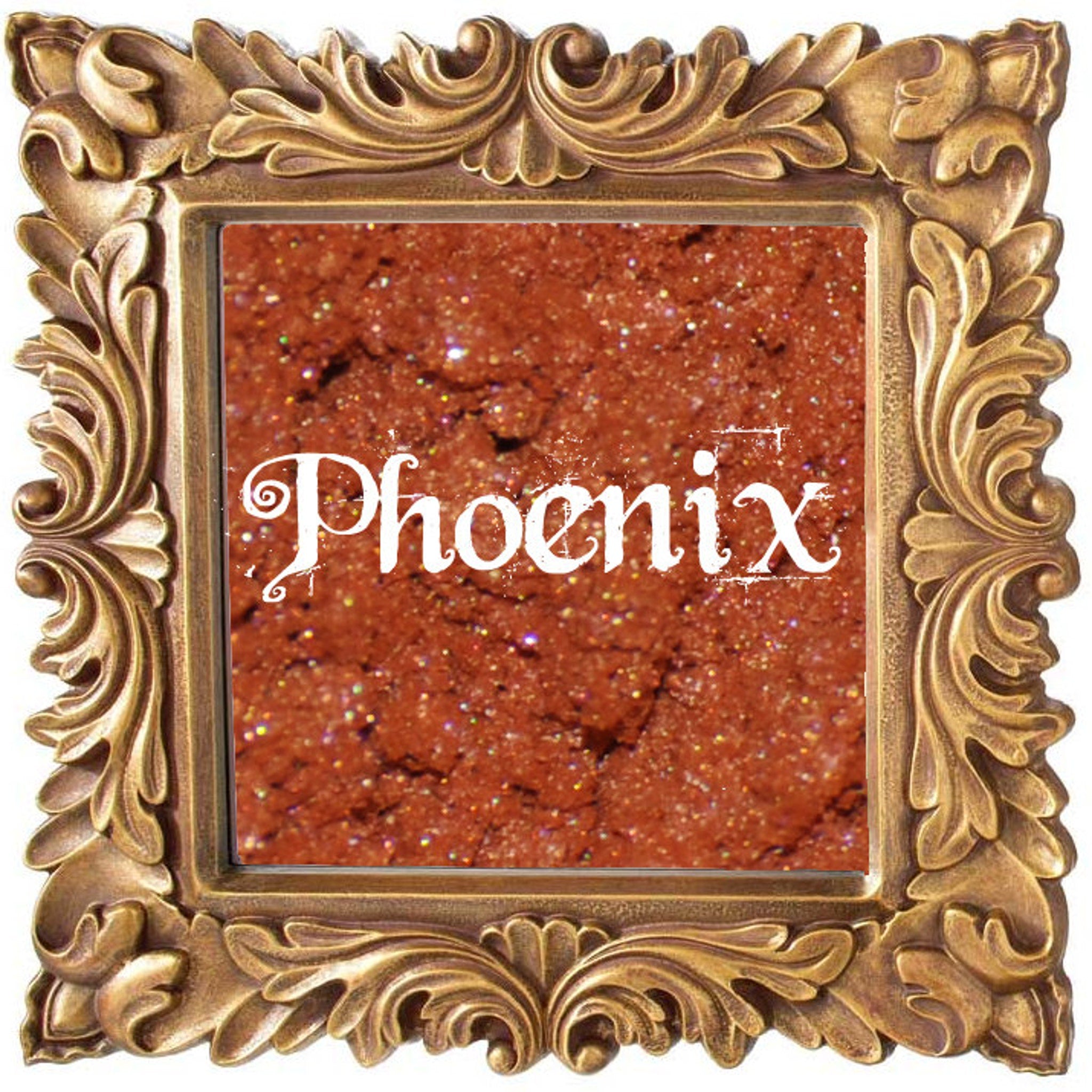 Small glass jar with black lid containing pigmented phoenix-orange mineral eye shadow and sifter insert