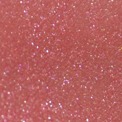 Side view of pink mineral eye shadow jar with sifter lid showing pigmented powder texture