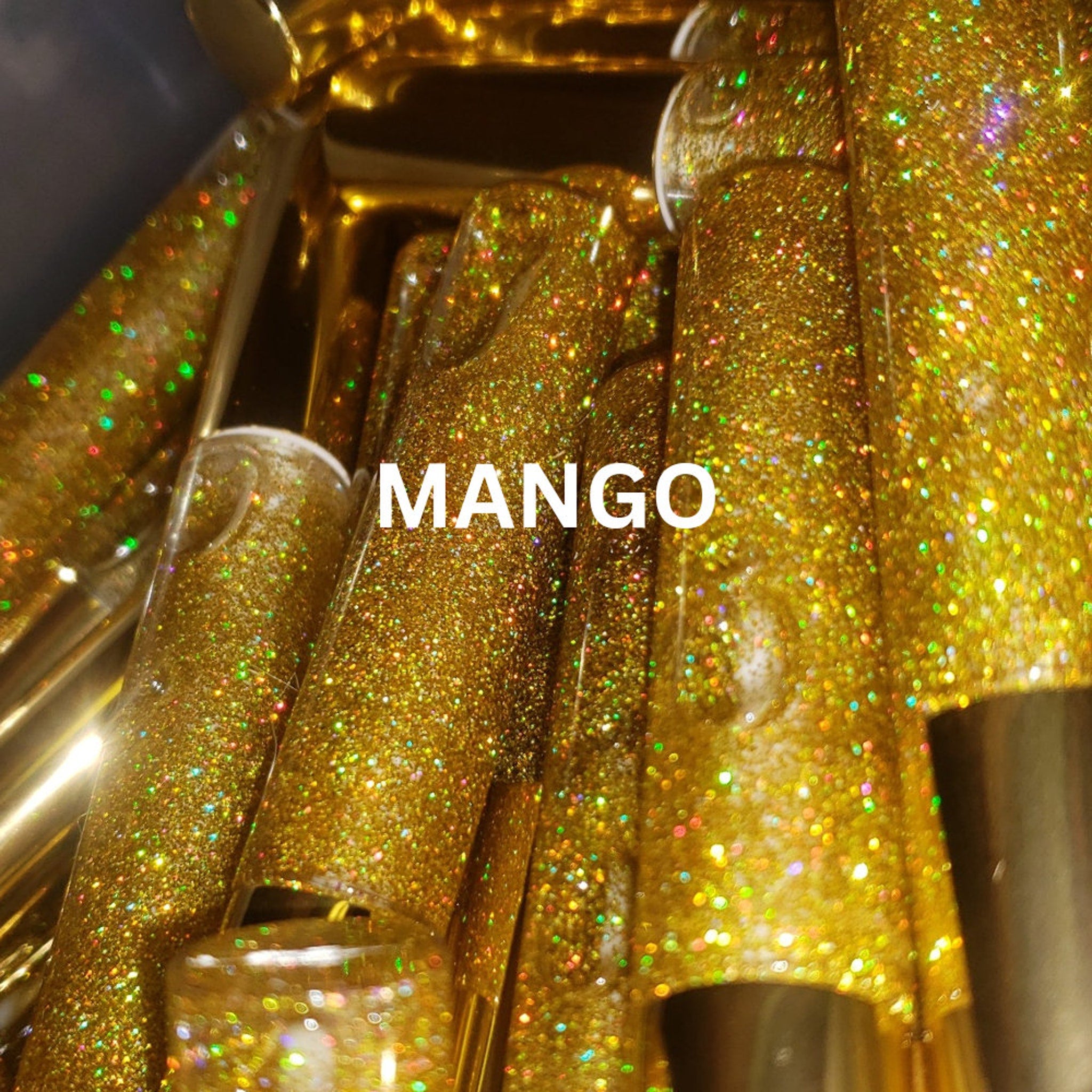 Mango lip gloss tubes with gold glitter, MANGO text visible, and cylindrical shape.