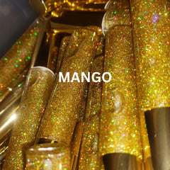 Mango lip gloss tubes with gold glitter, MANGO text visible, and cylindrical shape.