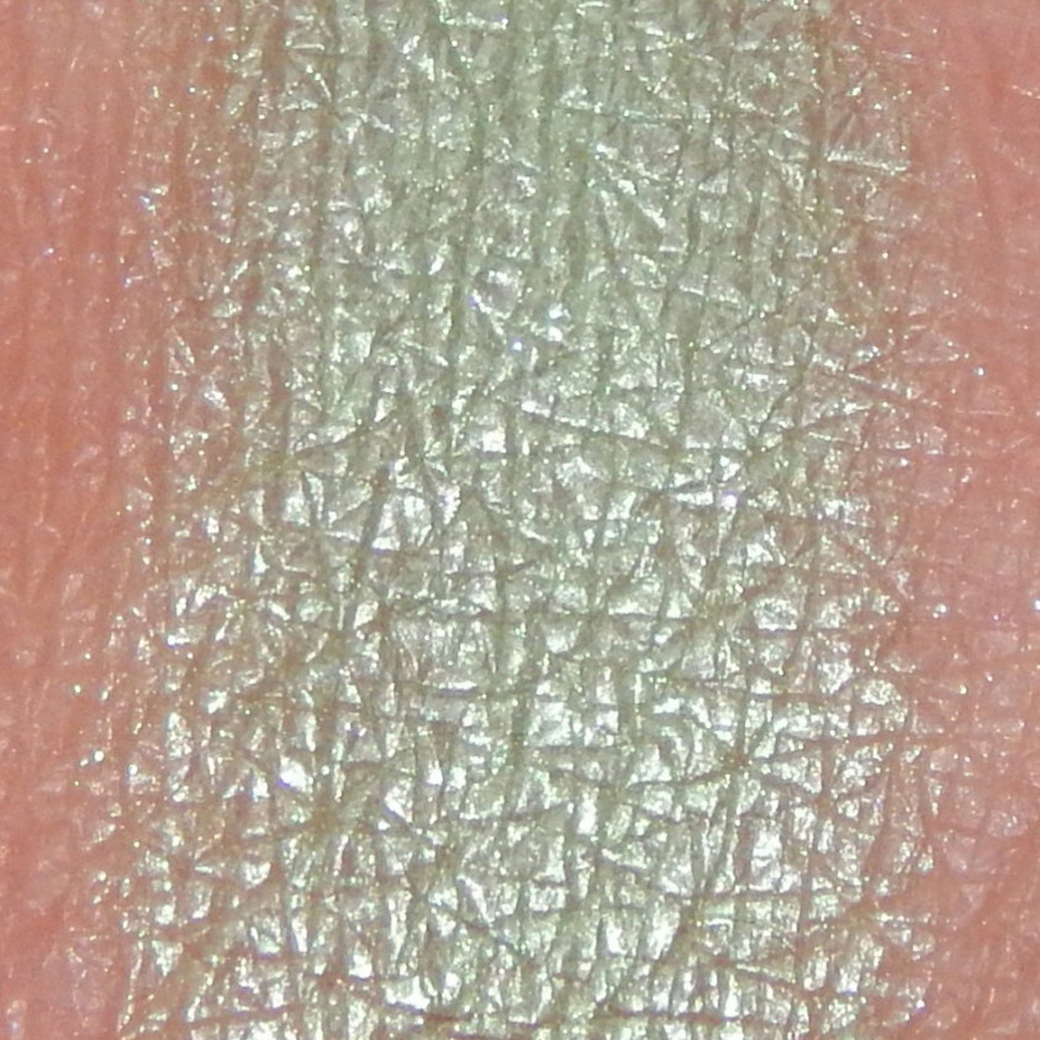 Side view of Fairy Frolic shimmery mineral eyeshadow in soft pastel hues with compact case