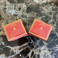 Eye shimmer boxes, red textured, gold trim, Disney Princess Revolution branding on boxes