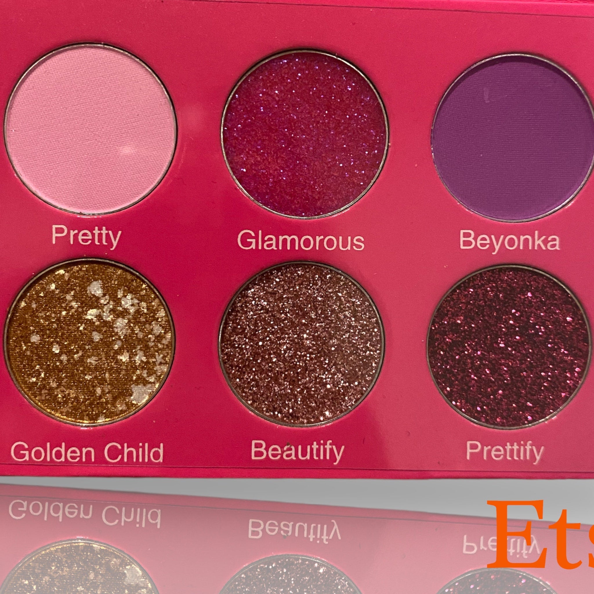 Close-up of the Pretty On Pretty Eye Shadow Palette showing shimmering pink and bronze shades with smooth, blendable textures