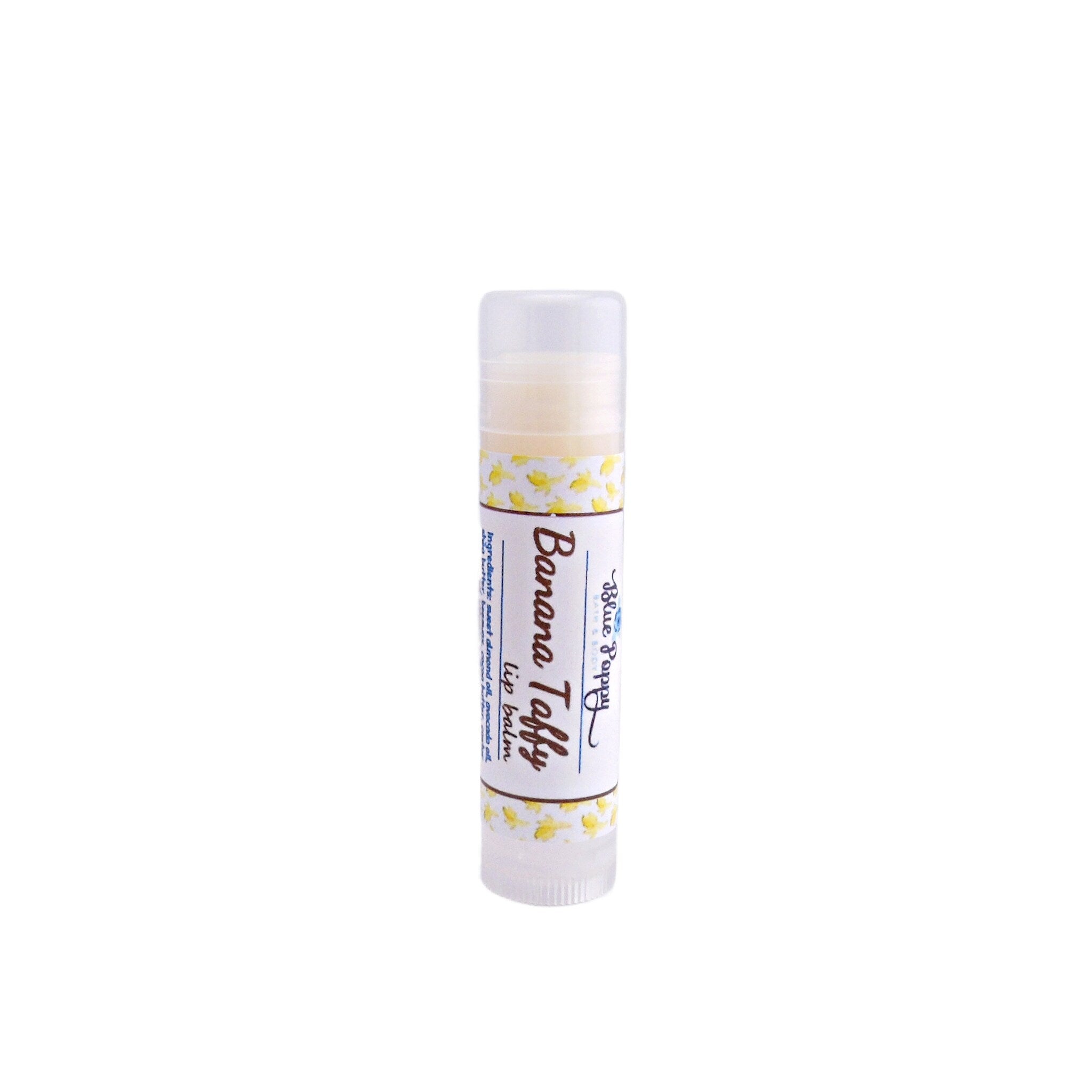 Lip balm tube with white and yellow pattern, clear cap, and Blue Poppy Bath brand text