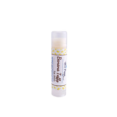 Lip balm tube with white and yellow pattern, clear cap, and Blue Poppy Bath brand text