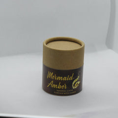 Face powder container, brown cardboard, Mermaid Amber text, cylindrical shape