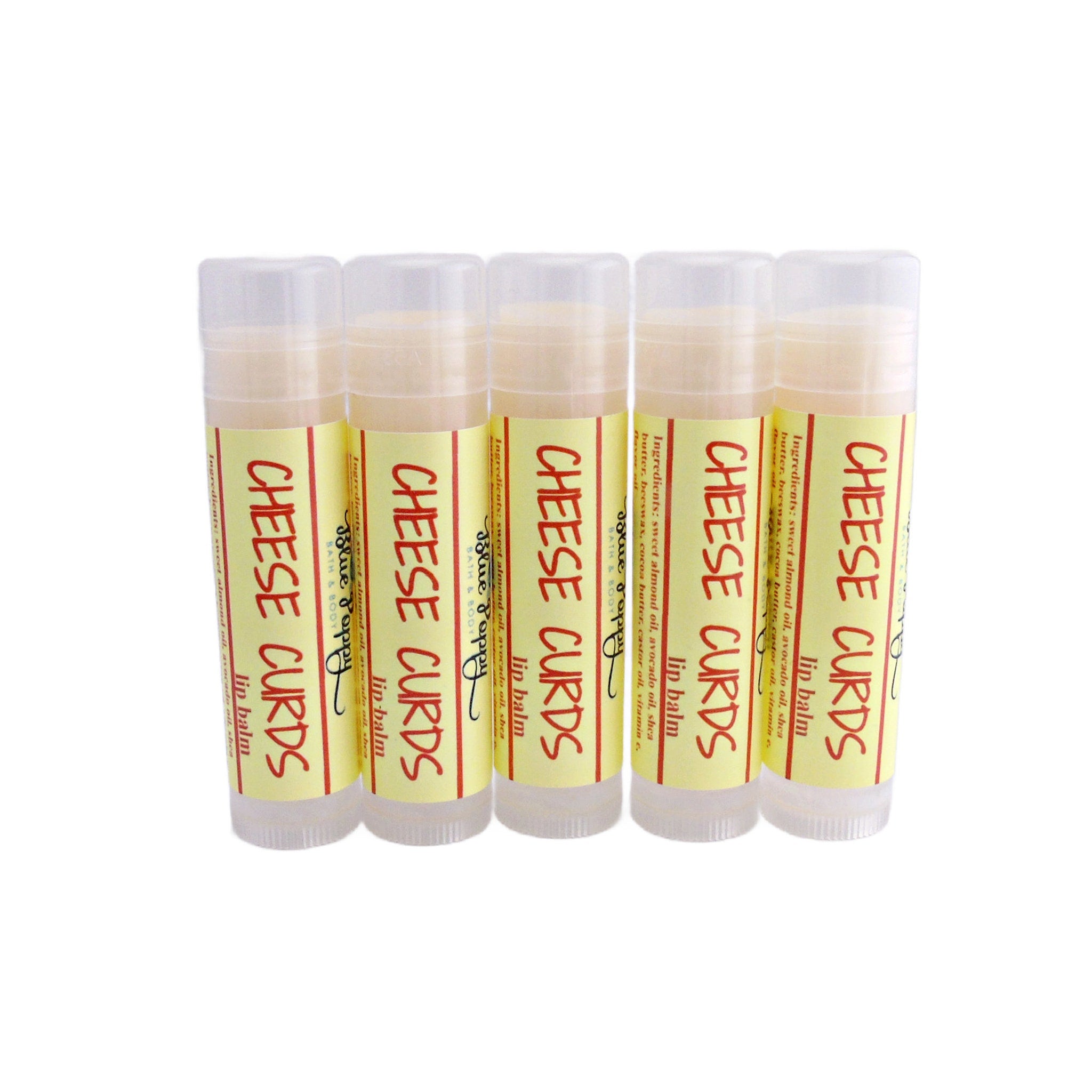Lip balm tubes with yellow labels, red text, and clear caps, Blue Poppy brand visible