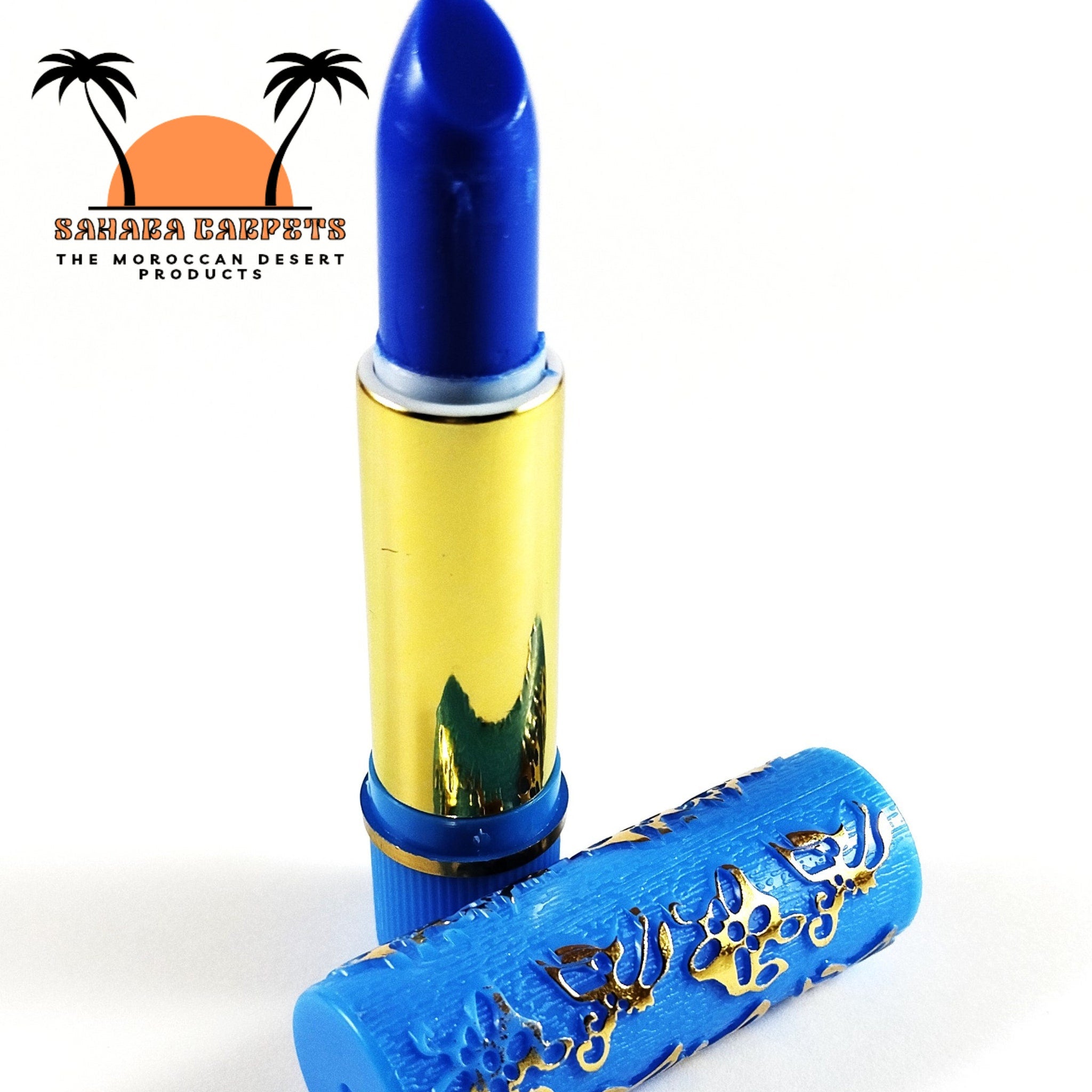 Lipstick with blue and gold colors, patterned cap, and visible brand name