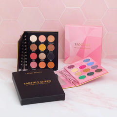 Close-up of makeup brush applying shimmery teal eyeshadow from palette onto eyelid