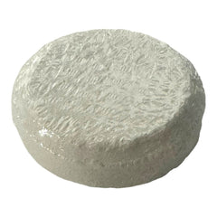 Cheese wheel with light gray color, textured surface, and round shape