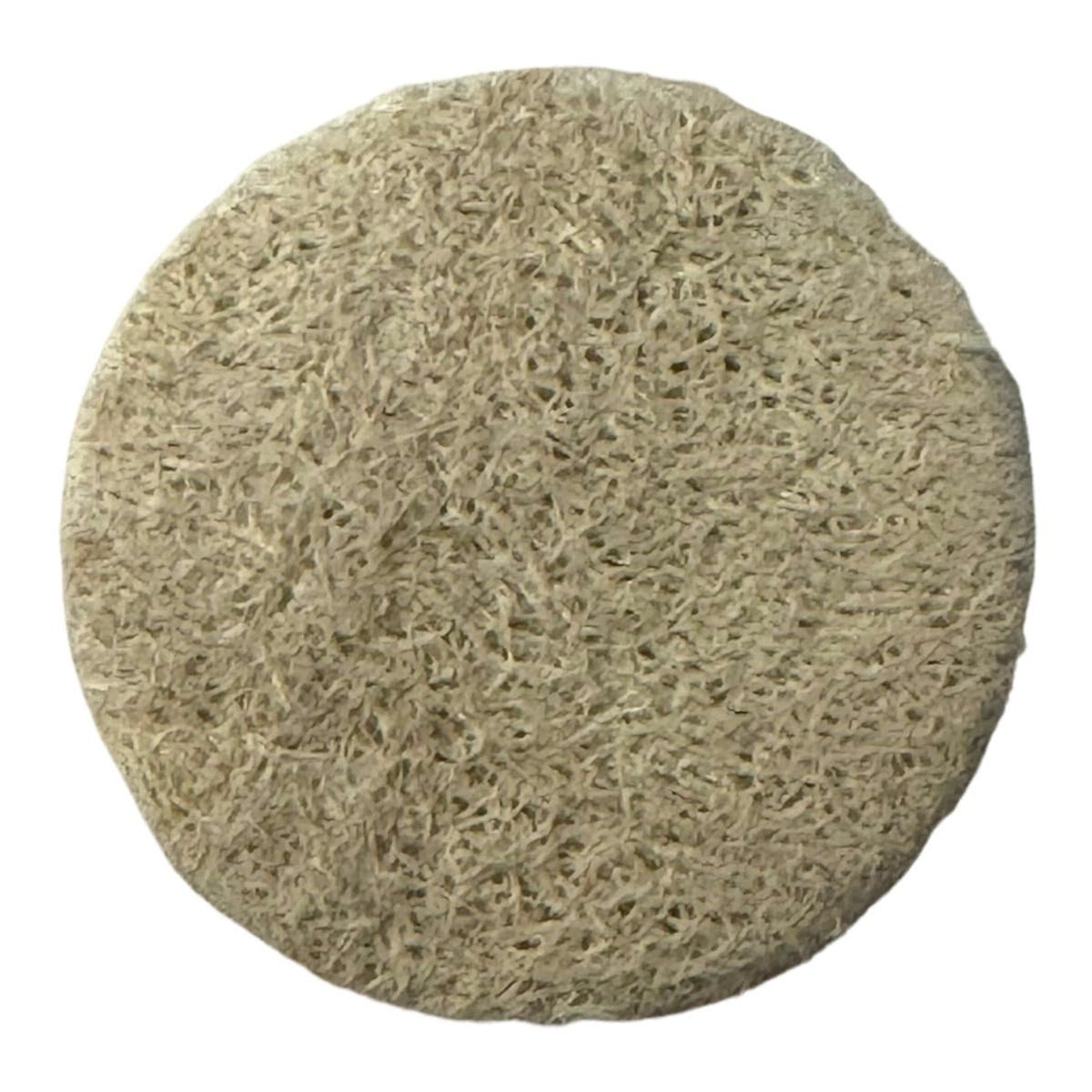 Loofah sponge, round, beige, natural fiber texture for use in the shower