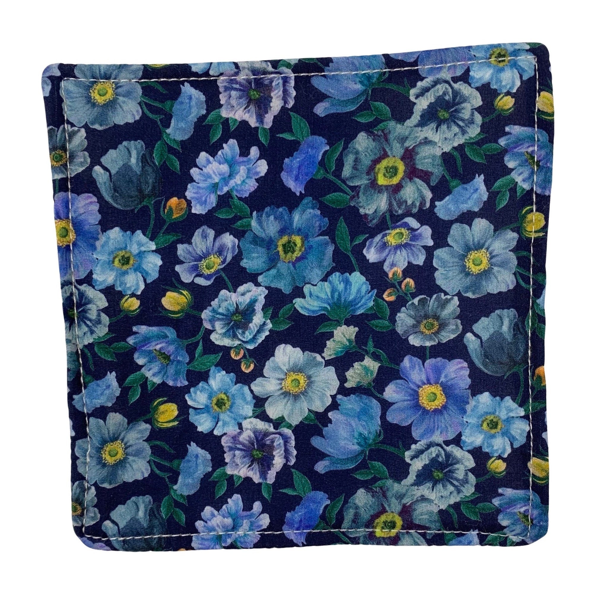 Floral print fabric coaster with blue flowers on navy background, white stitched edge