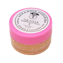 Close-up of all-natural lip scrub in glass jar showing sugar crystals and creamy texture with minimalist label