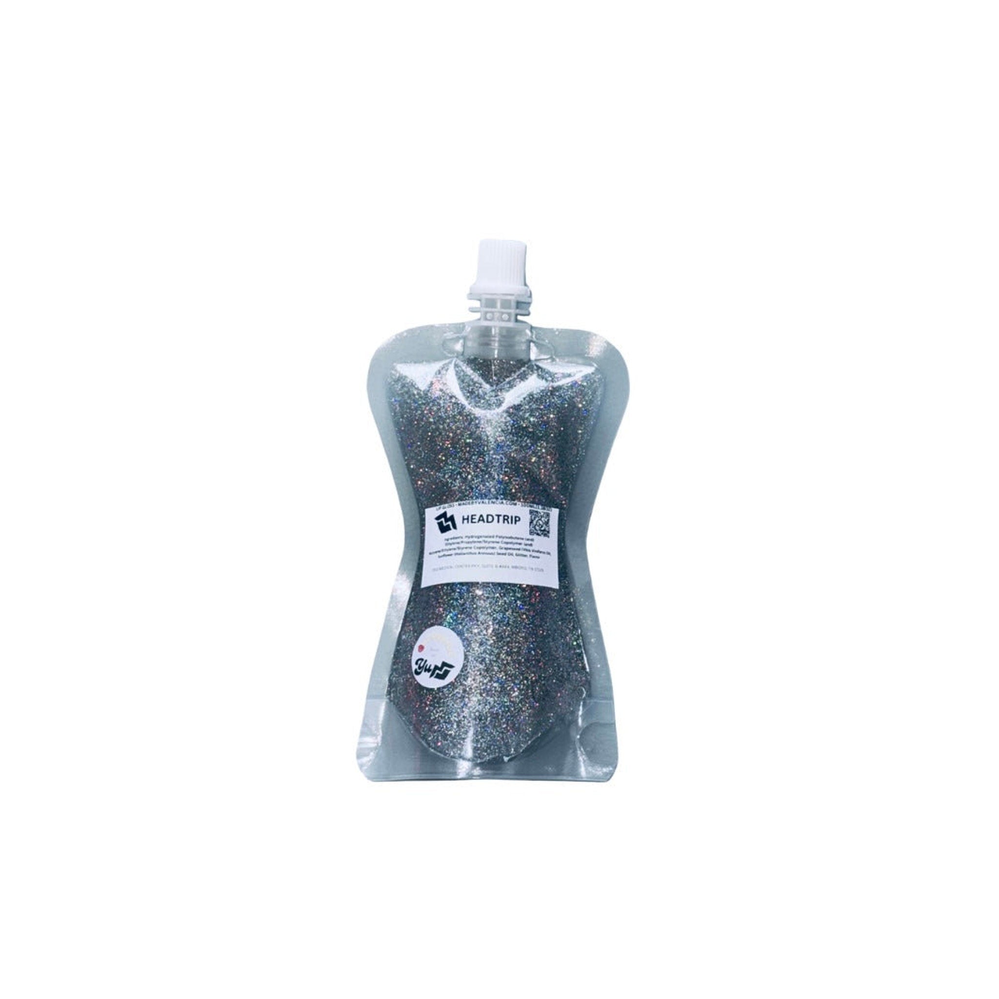 Glitter in clear plastic pouch with white cap, "HEADTRIP" label, and "Glu" logo visible.