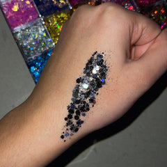 Glitter gel eyeshadow palette with 24 vibrant shades and black glitter in sleek black packaging