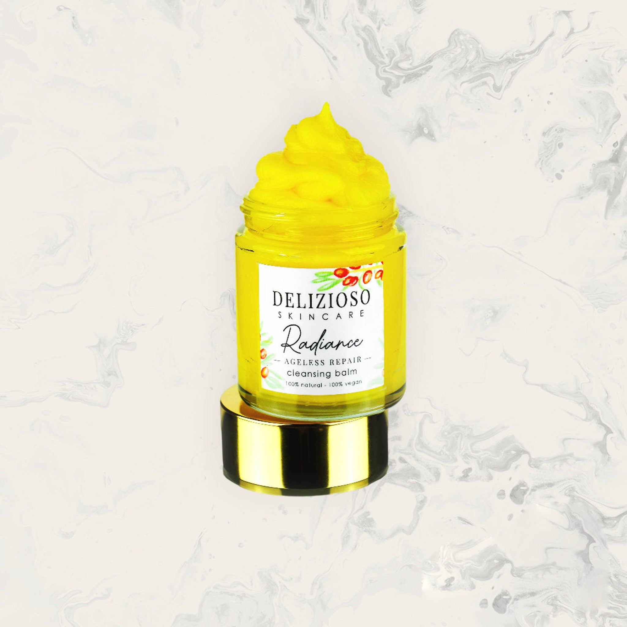 Cleansing balm jar with yellow balm, glass jar, and gold lid, DELIZIOSO skincare label