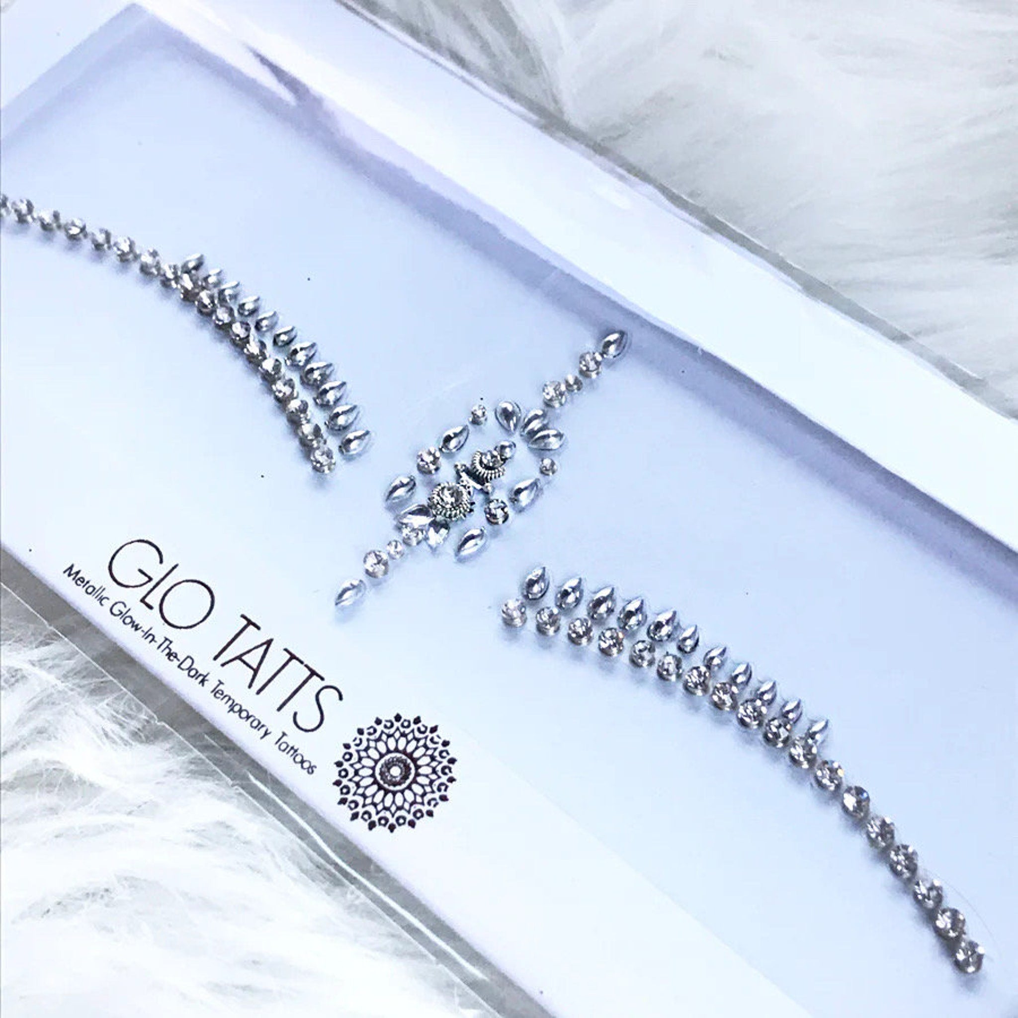 Face gems bindi, silver rhinestone style, GLO TATTS brand, on white backing