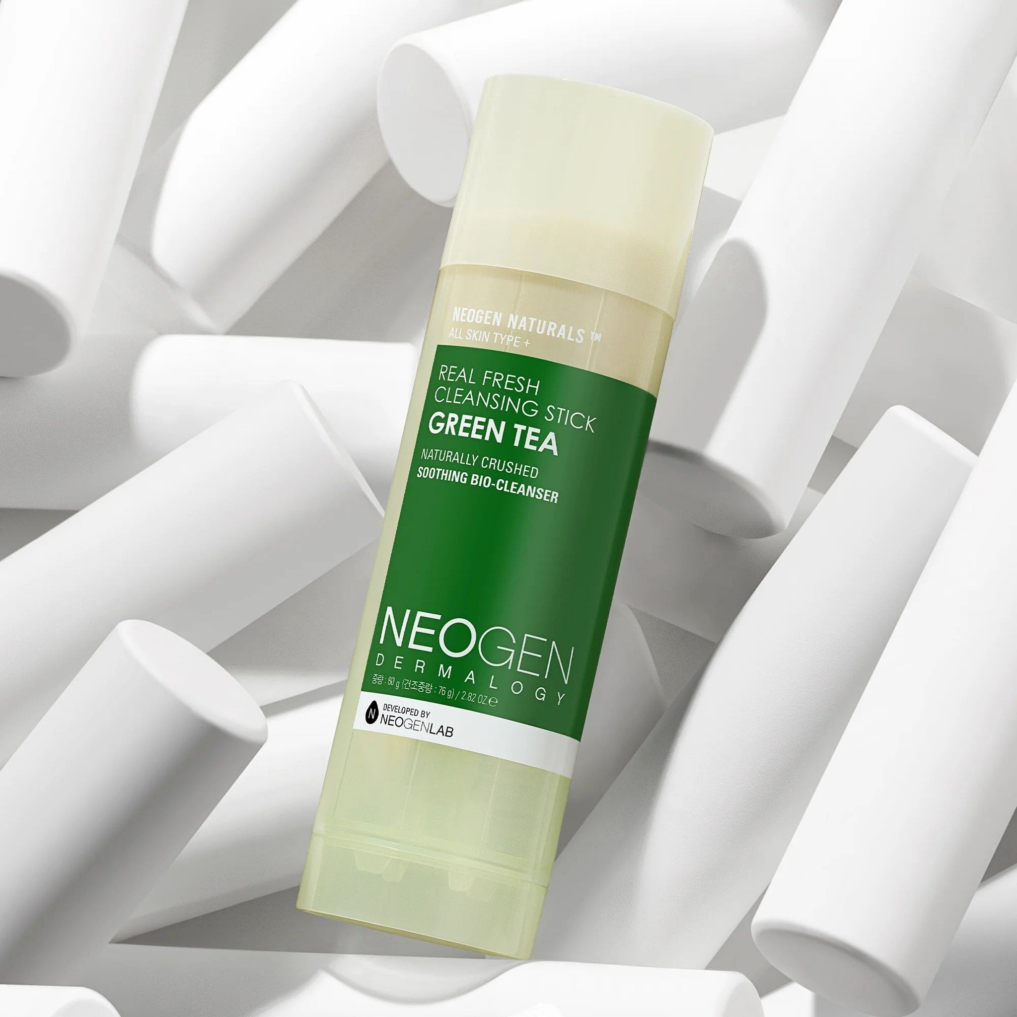 Cleansing stick with green and white packaging, NEOGEN brand name visible, on white background