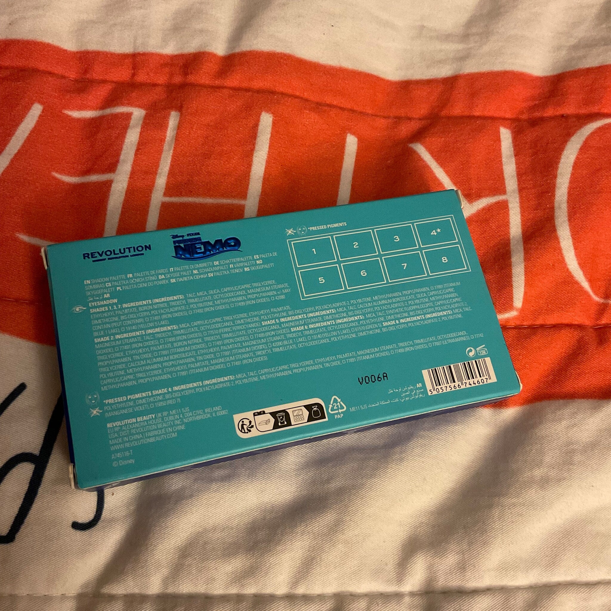 Front view of Disney Finding Nemo Crush eyeshadow palette showing turquoise seashell-shaped compact with coral details