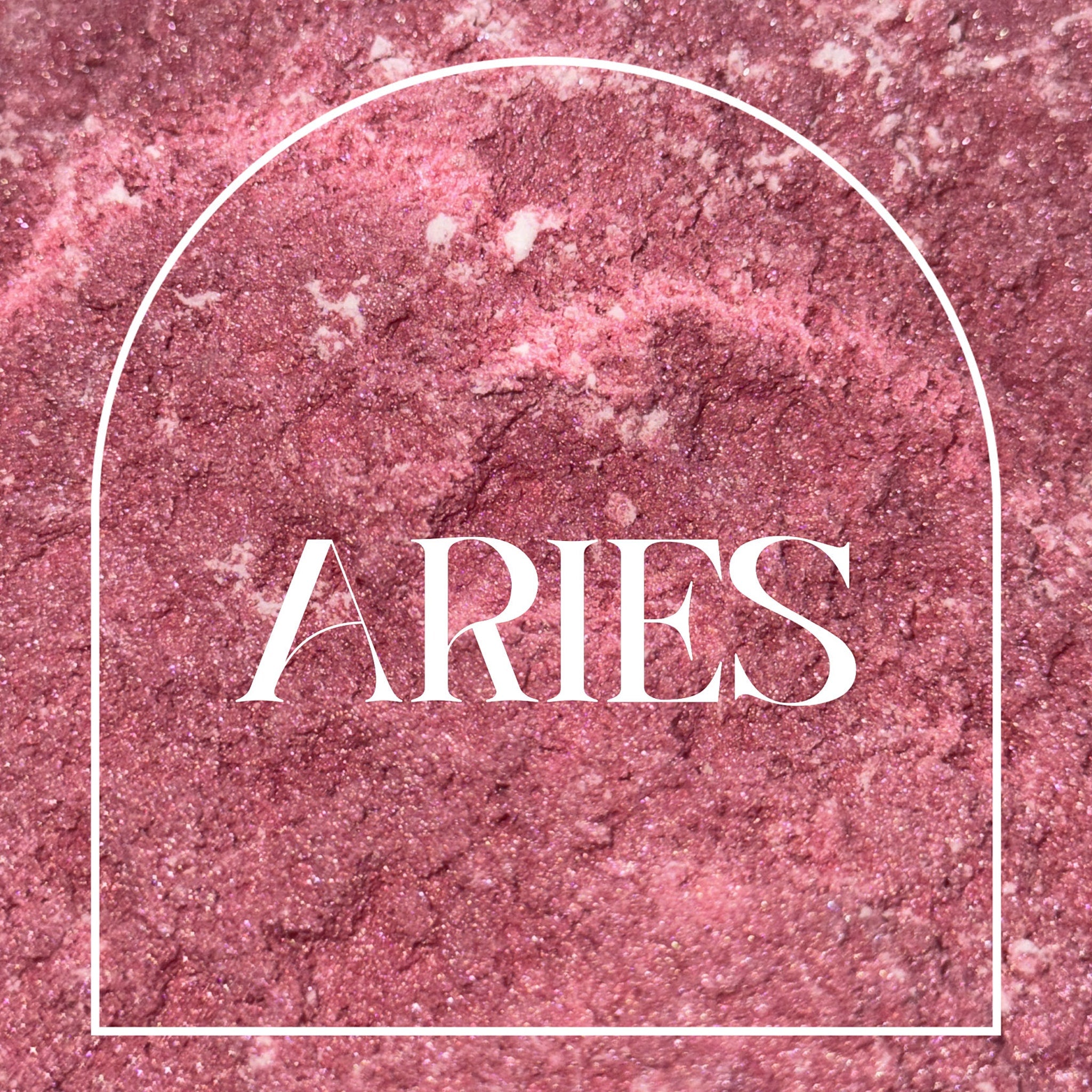 Aries text on pink glittery background with white arch frame