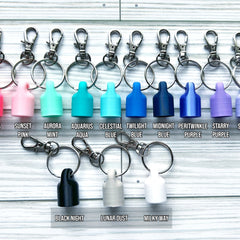 Keychains with various colors, metal rings, and lobster clasp attachments