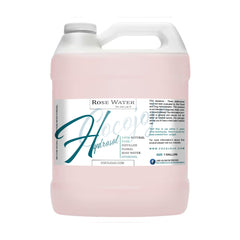 Rose water toner in a white plastic jug with pink liquid, Cocojojo label, and handle