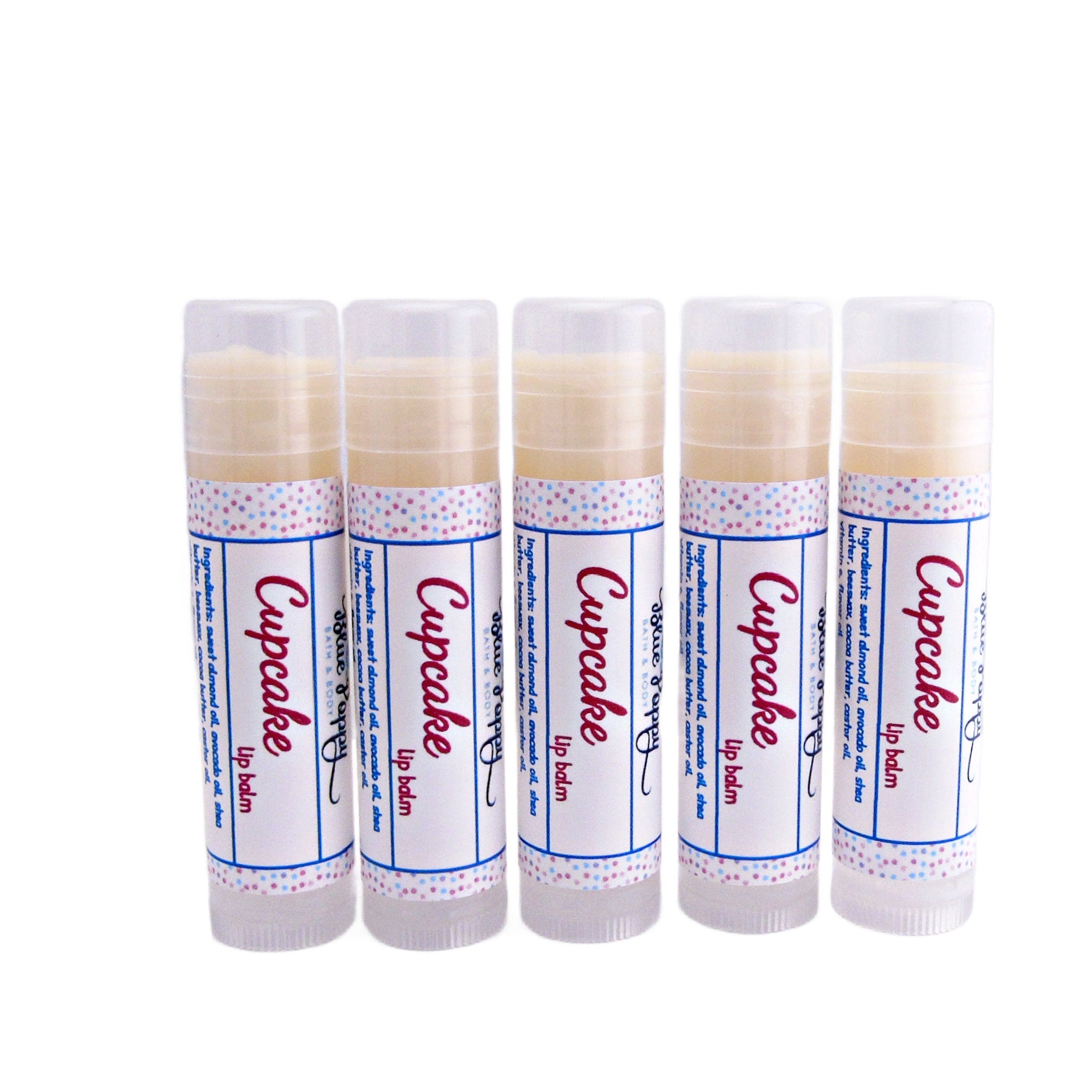 Lip balm tubes with white labels, polka dot pattern, and "Cupcake" text, for lip care