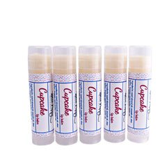 Lip balm tubes with white labels, polka dot pattern, and "Cupcake" text, for lip care