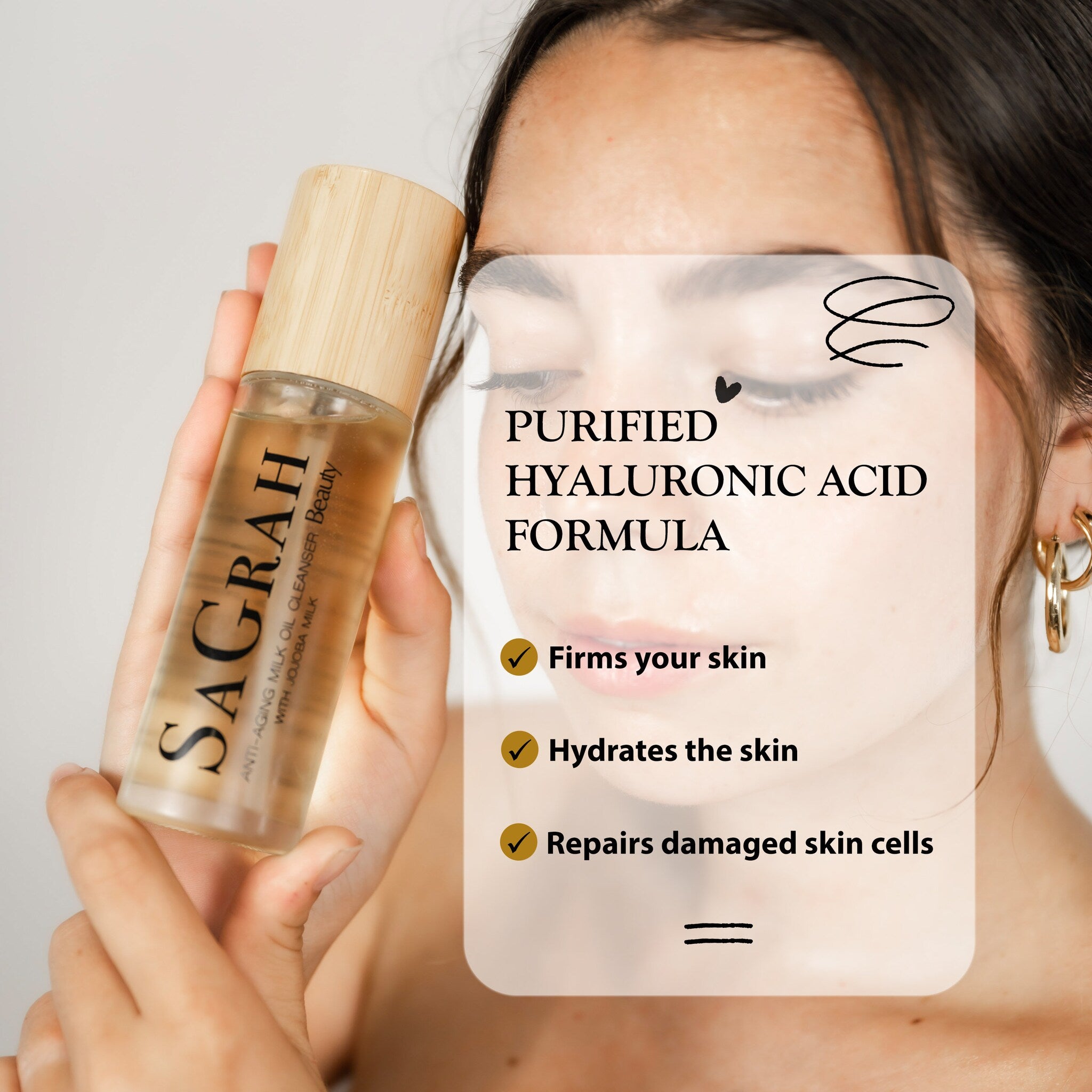 Milk oil cleanser bottle with wooden cap, clear liquid, held by hand, Sagrah brand